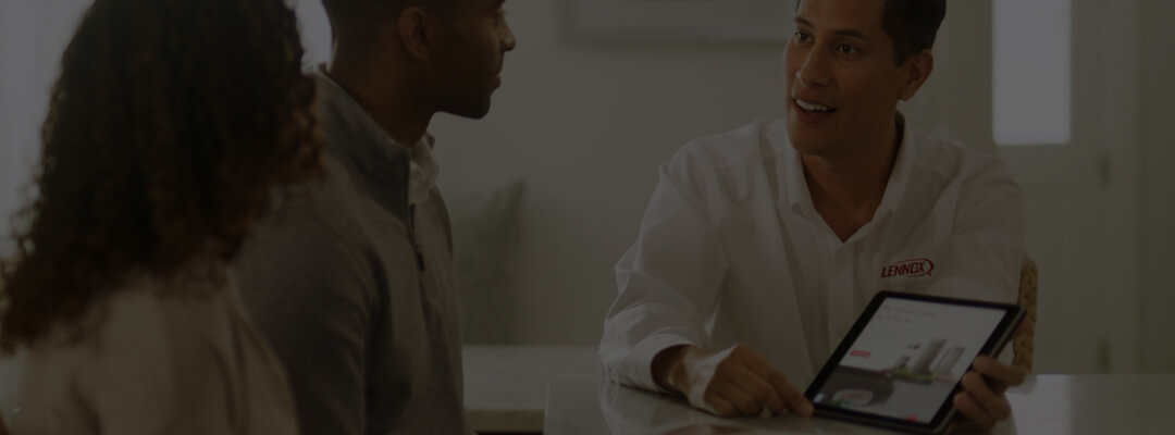Image of two men talking.